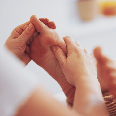 Applying foot reflexology